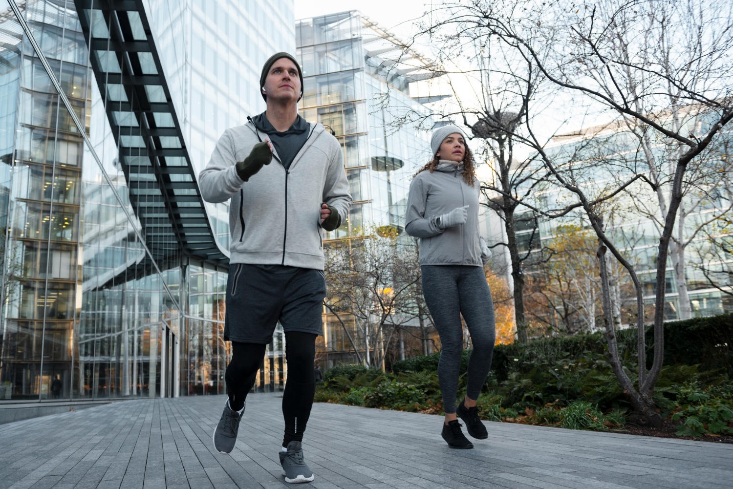 couple running through city streets
